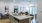 a kitchen with a large island and a living room with a couch