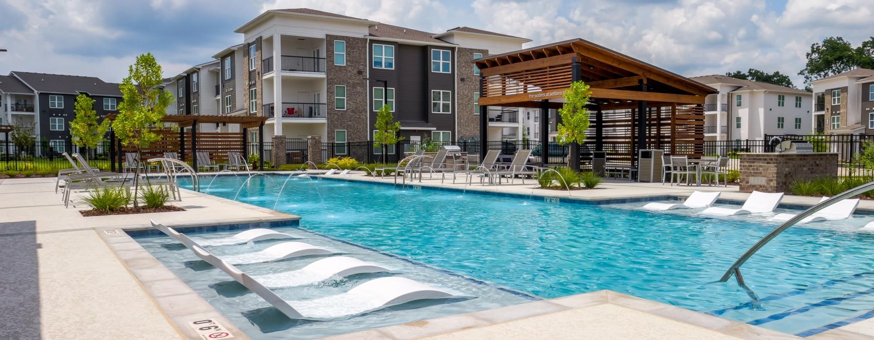 a swimming pool in front of a building