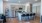 a kitchen with an island and chairs