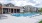 a swimming pool in front of a building