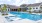 a swimming pool in front of a building