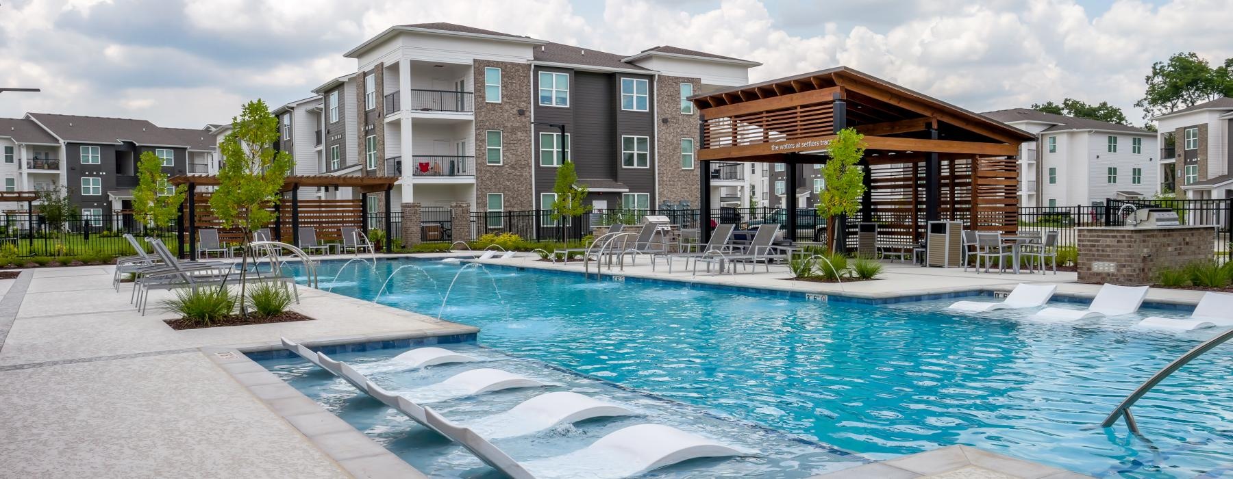 a swimming pool in front of a building