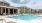 a swimming pool in front of a building