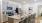 a kitchen with an island and chairs