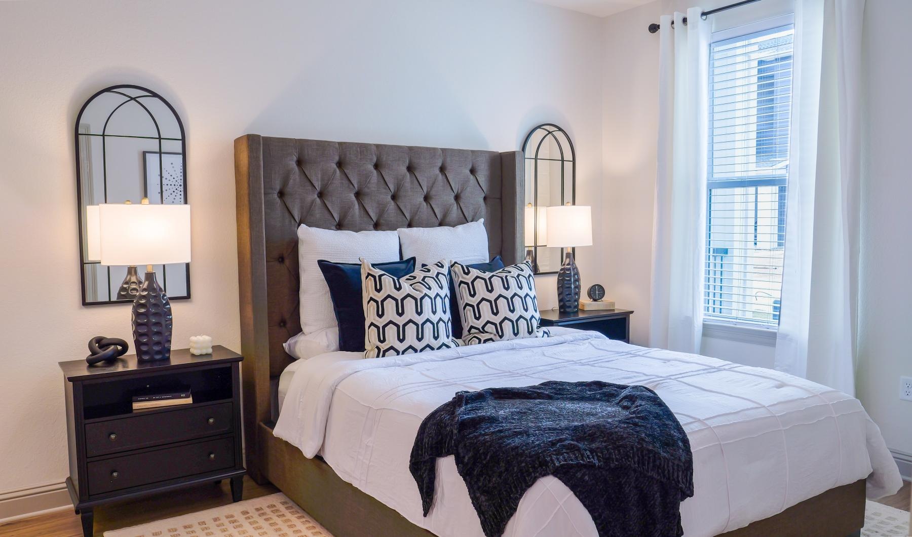 Beautiful bedrooms to fit every need a bed with a black blanket