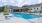 a swimming pool in front of a building