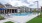 a swimming pool in front of a building