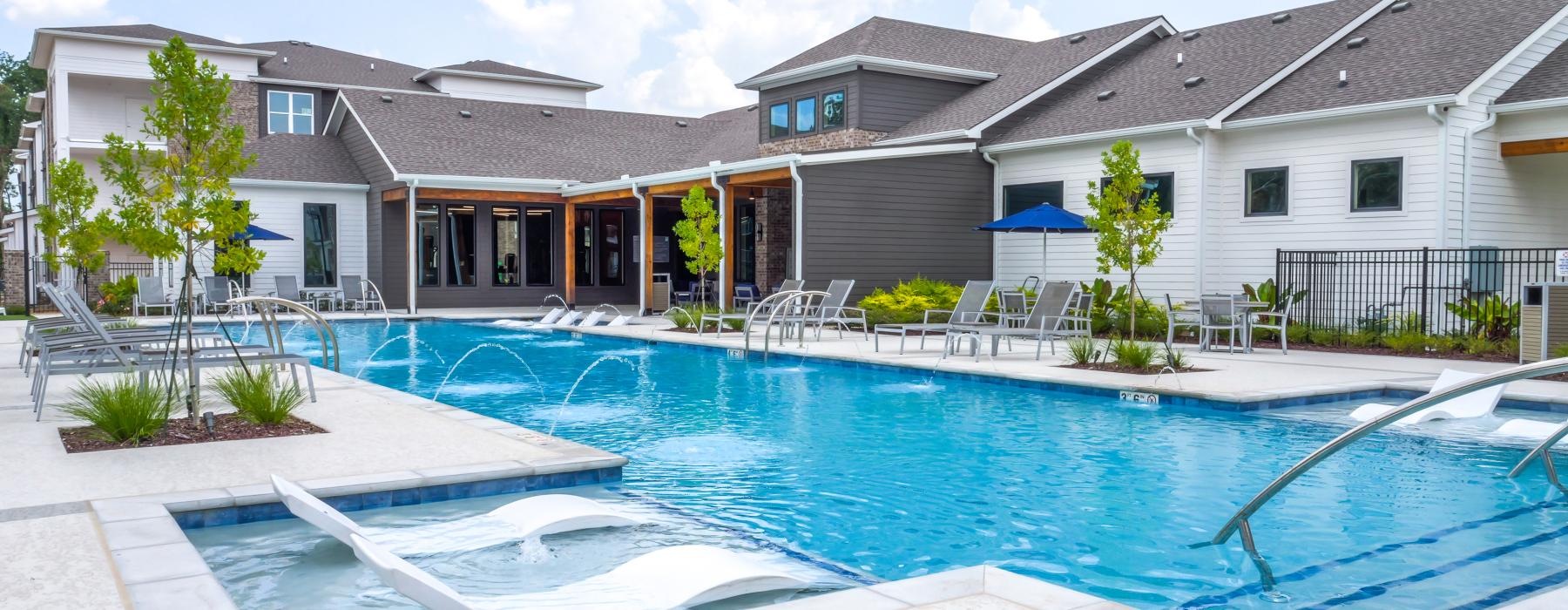a swimming pool in front of a building
