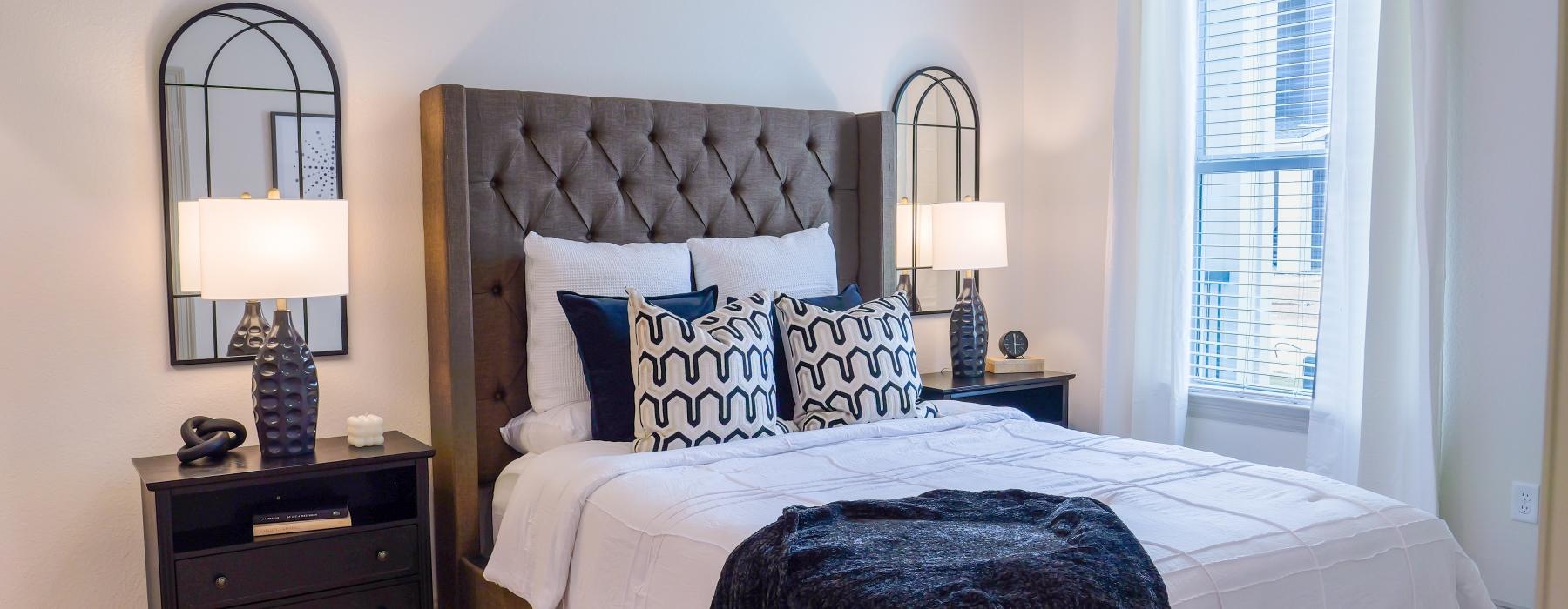 a bed with a black blanket