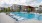 a swimming pool in front of a building